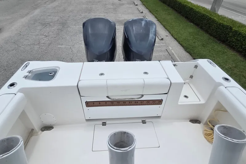 Slide: The Image of 2015 Tidewater 280 CC Adventure boat with dual engines and spacious deck layout. - 4