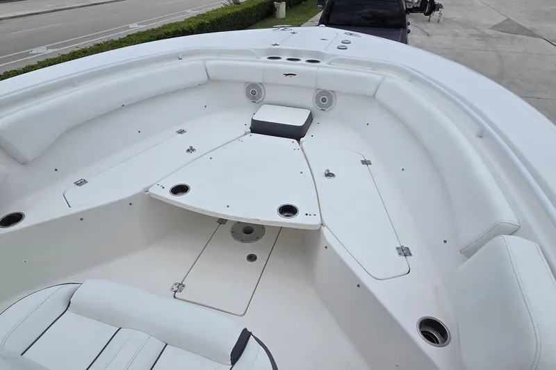 Slide: The Image of 2015 Tidewater 280 CC Adventure boat interior with spacious seating and storage compartments. - 9