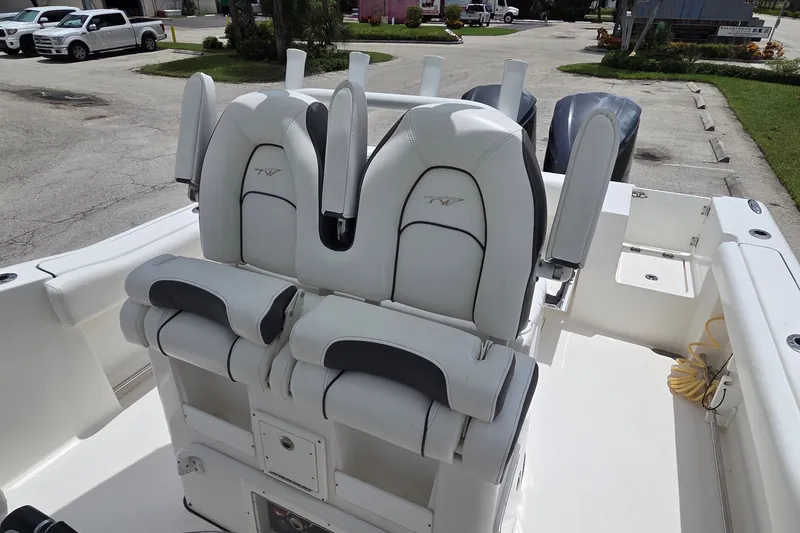 Slide: The Image of 2015 Tidewater 280 CC Adventure boat with dual white captain's chairs. - 22