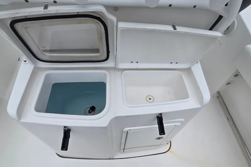 Slide: The Image of Livewell and storage compartments on a 2015 Tidewater 280 CC Adventure boat. - 6