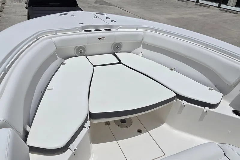 Slide: The Image of 2015 Tidewater 280 CC Adventure boat with spacious white seating area and cup holders. - 15