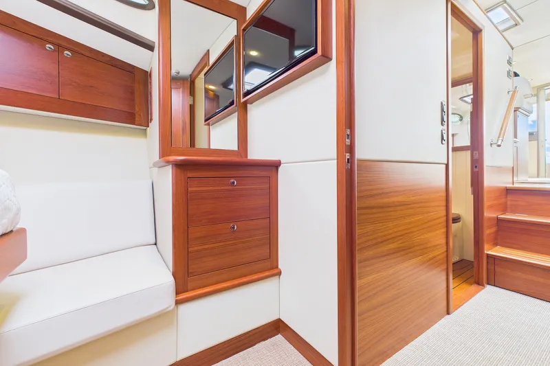 Slide: The Image of Luxurious interior of 2018 Palm Beach Motor Yachts PB50, featuring elegant wood finishes and modern design. - 21