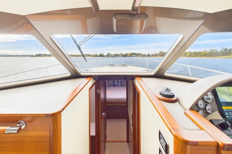 Slide: The Image of 2018 Palm Beach Motor Yachts PB50 interior with panoramic water view through windshield. - 6