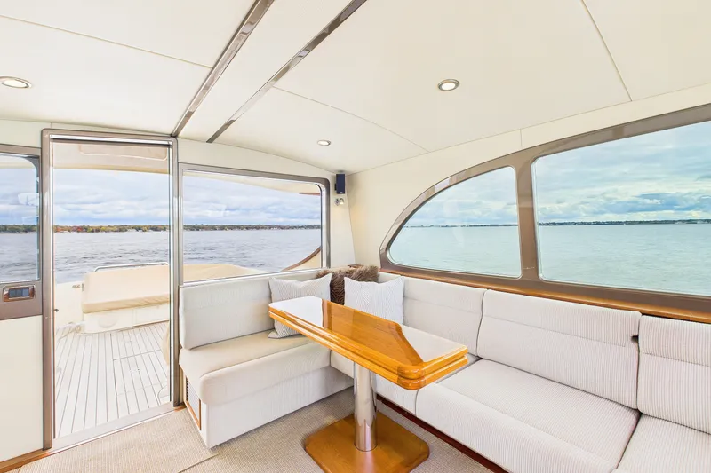 Slide: The Image of Interior of 2018 Palm Beach Motor Yachts PB50 with elegant seating and scenic water view. - 11