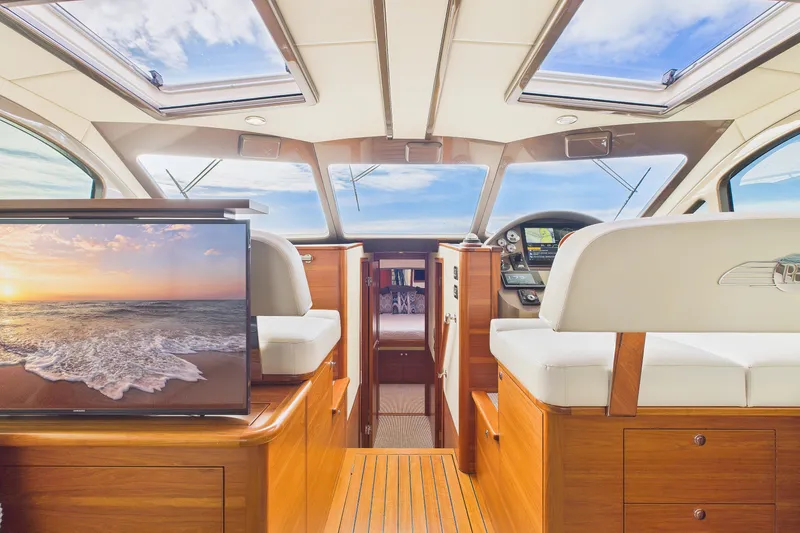 Slide: The Image of Luxurious interior of 2018 Palm Beach Motor Yachts PB50 with elegant wood finish and skylights. - 7