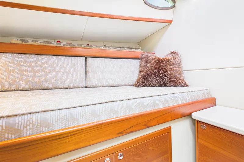 Slide: The Image of Luxurious interior of 2018 Palm Beach Motor Yachts PB50 with plush bedding and wooden accents. - 23