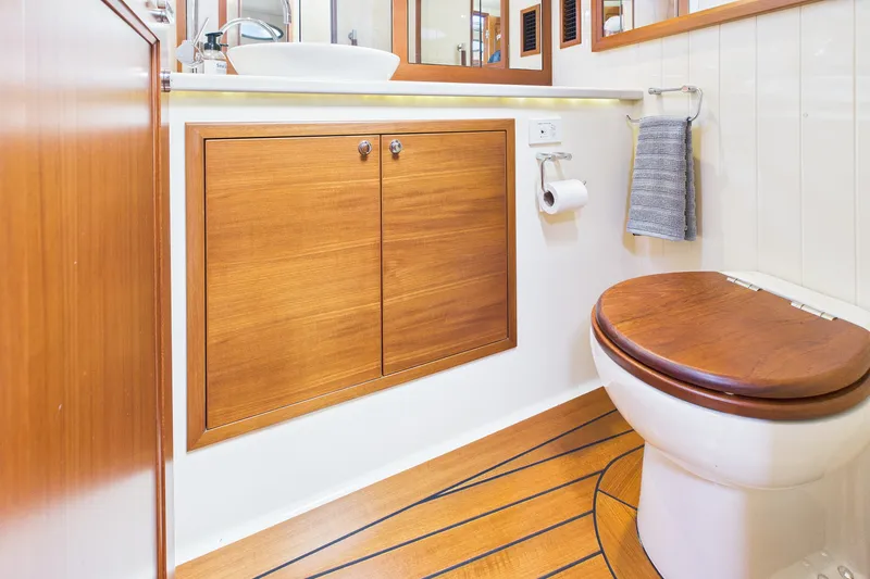 Slide: The Image of Luxurious 2018 Palm Beach Motor Yachts PB50 bathroom with wooden accents and modern fixtures. - 27