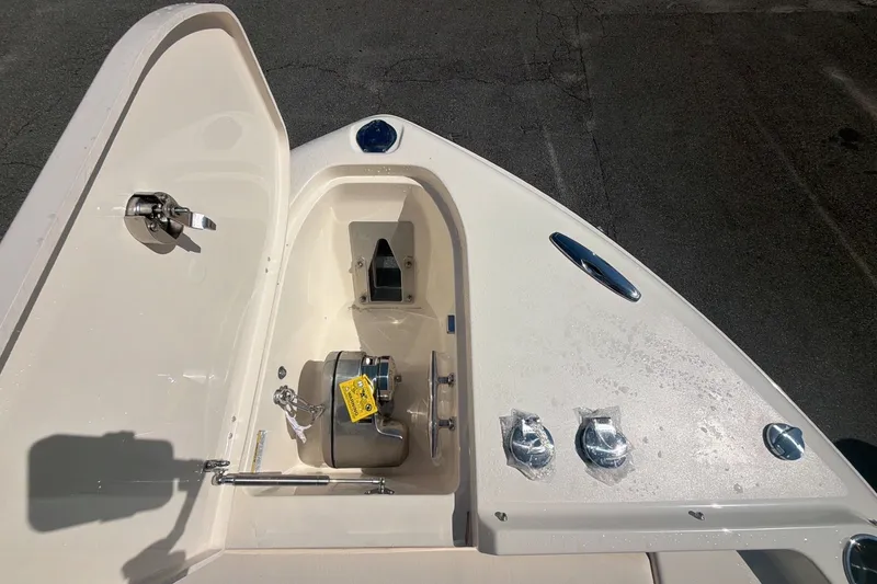 Slide: The Image of Bow storage compartment on a 2027 Grady-White Freedom 285 boat, featuring anchor and hardware. - 10