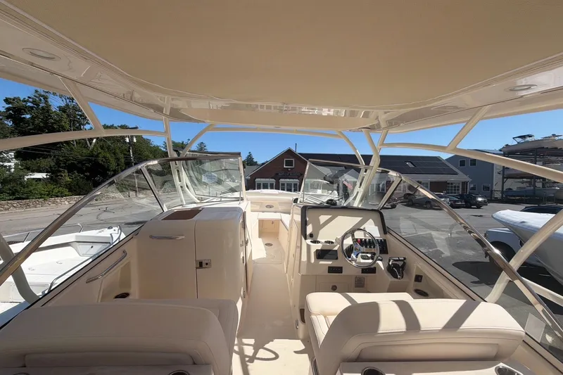 Slide: The Image of Interior view of 2027 Grady-White Freedom 285 boat, showcasing helm and seating area. - 7