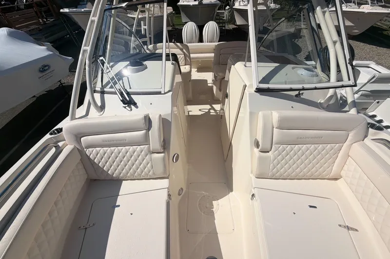 Slide: The Image of 2027 Grady-White Freedom 285 boat interior with luxurious seating and modern design. - 12