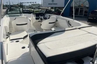 Slide: The Image of 2017 Sea Ray SPX 210 Outboard boat interior with white seating and modern design. - 7