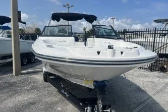 Slide: The Image of 2017 Sea Ray SPX 210 Outboard boat on trailer, displayed outdoors. - 3
