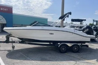Slide: The Image of 2017 Sea Ray SPX 210 Outboard boat on trailer in sunny parking lot. - 5