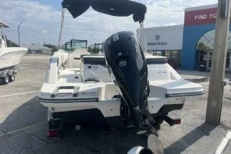 Slide: The Image of 2017 Sea Ray SPX 210 Outboard boat in a marina parking lot. - 6