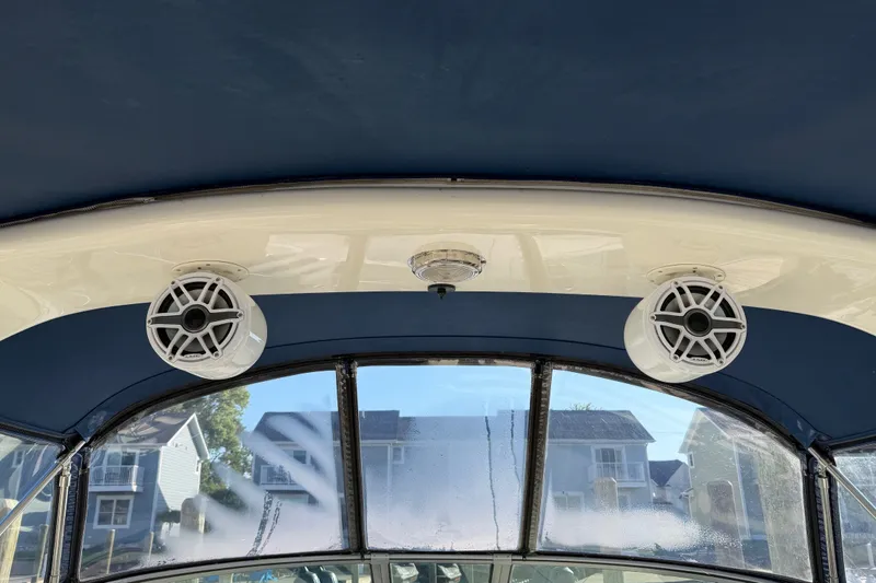 Slide: The Image of Interior view of 2003 Sea Ray Sundancer 320 boat with mounted speakers. - 12
