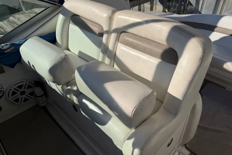 Slide: The Image of White leather seating on a 2003 Sea Ray Sundancer 320 boat. - 14