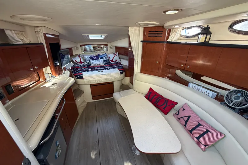 Slide: The Image of Luxurious interior of 2003 Sea Ray Sundancer 320 yacht with cozy seating and elegant decor. - 23