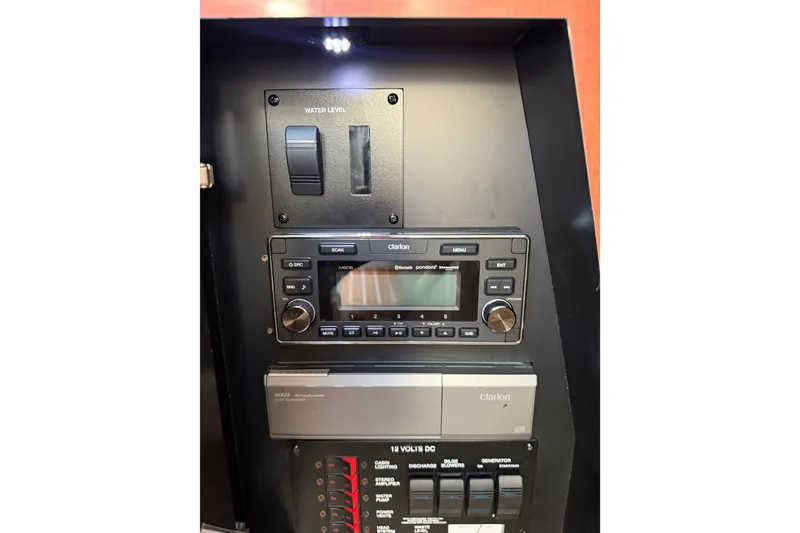 Slide: The Image of Control panel of a 2003 Sea Ray Sundancer 320 boat with Clarion audio system. - 20