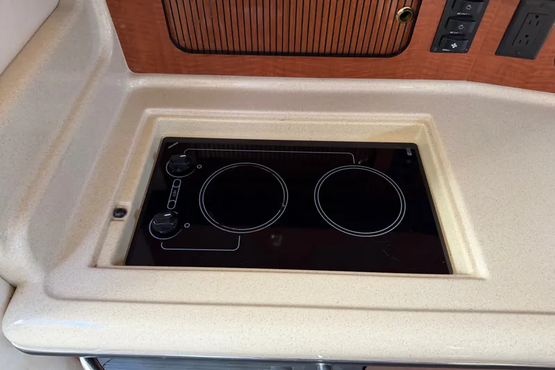 Slide: The Image of Built-in stovetop on 2003 Sea Ray Sundancer 320 yacht, featuring dual burners and sleek design. - 35