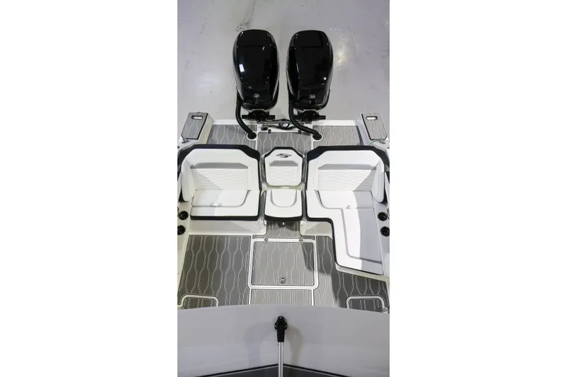 Slide: The Image of 2022 Sunsation 32 CCX boat interior with dual engines and sleek seating design. - 7
