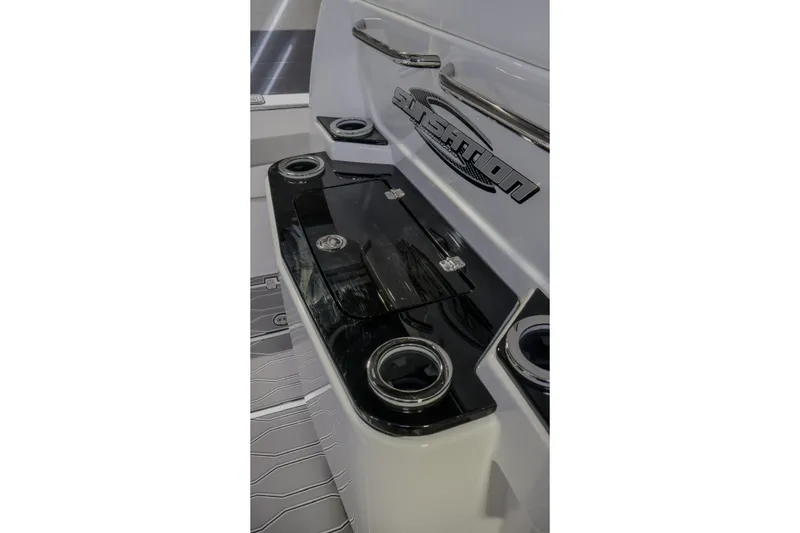 Slide: The Image of 2022 Sunsation 32 CCX boat interior with sleek design and cup holders. - 9