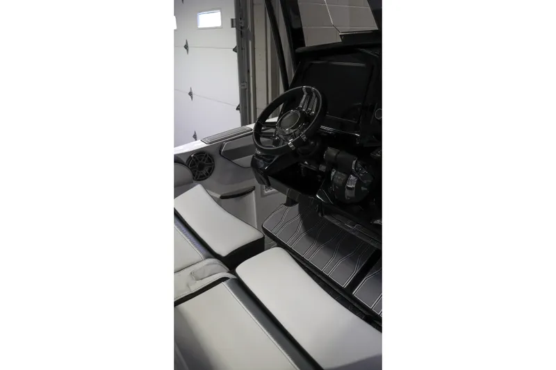 Slide: The Image of Interior of 2022 Sunsation 32 CCX boat featuring steering wheel and seating. - 12