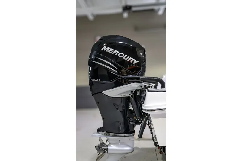 Slide: The Image of 2022 Sunsation 32 CCX with Mercury Verado outboard engine, sleek black design. - 5