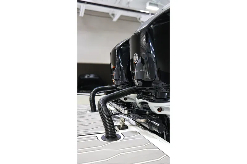 Slide: The Image of 2022 Sunsation 32 CCX boat engines with sleek black design and modern features. - 6