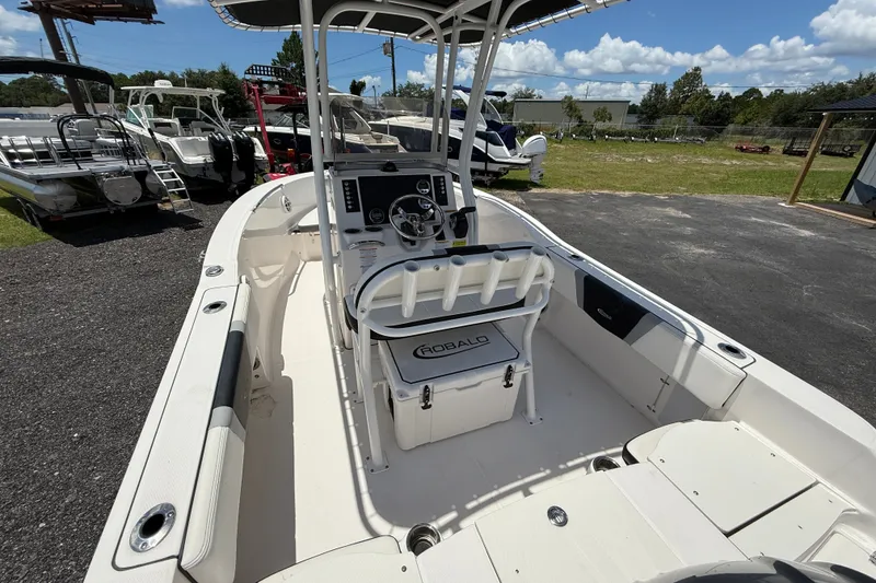 Slide: The Image of 2024 Robalo R180 Center Console boat with spacious deck and modern controls. - 7