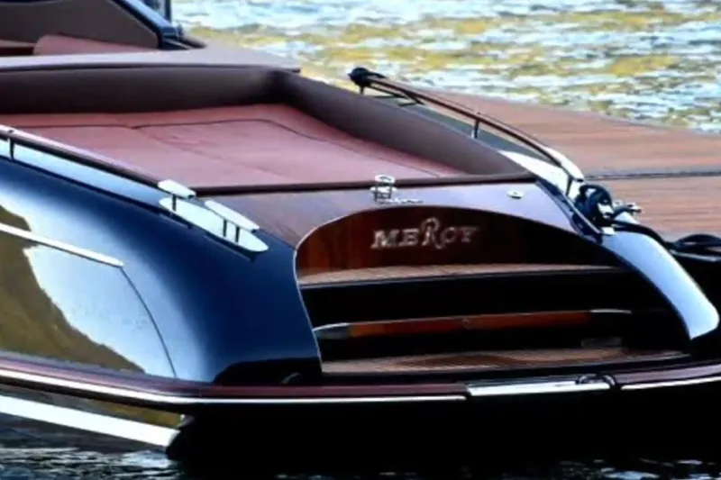 Slide: The Image of 2009 Riva 33' Aquariva luxury boat docked on water. - 4