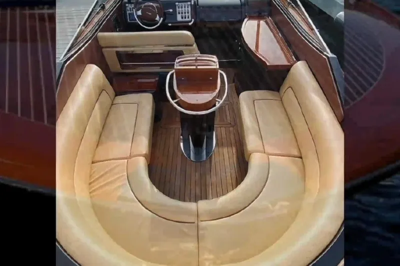 Slide: The Image of Luxurious interior of 2009 Riva 33' Aquariva with elegant seating and wooden finishes. - 7