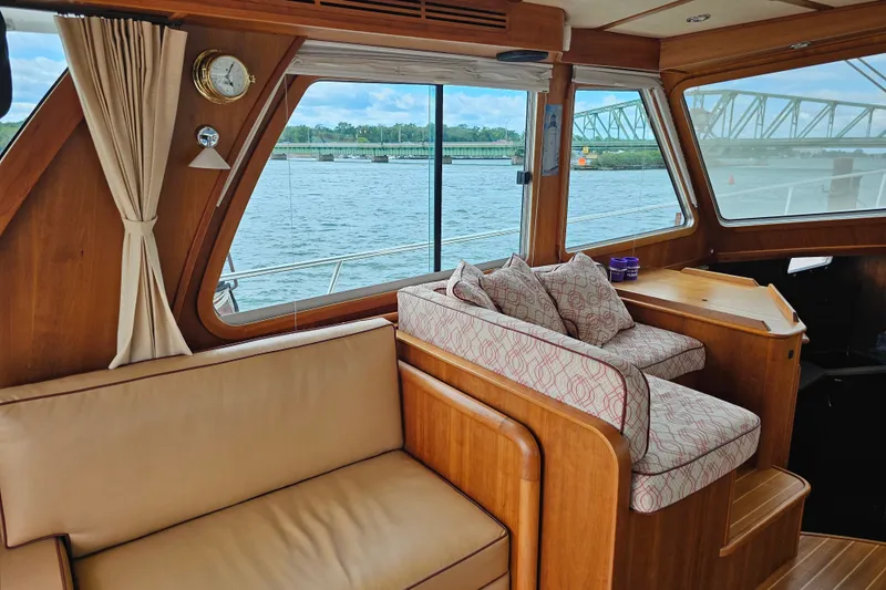 Slide: The Image of Interior of 2013 Sabre 48 Salon Express yacht with comfortable seating and scenic water view. - 12