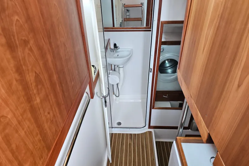 Slide: The Image of Compact bathroom and laundry area on 2013 Sabre 48 Salon Express yacht. - 45
