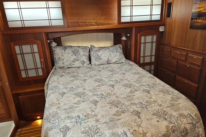 Slide: The Image of Luxurious bedroom interior of 2013 Sabre 48 Salon Express yacht with elegant wood finish. - 35