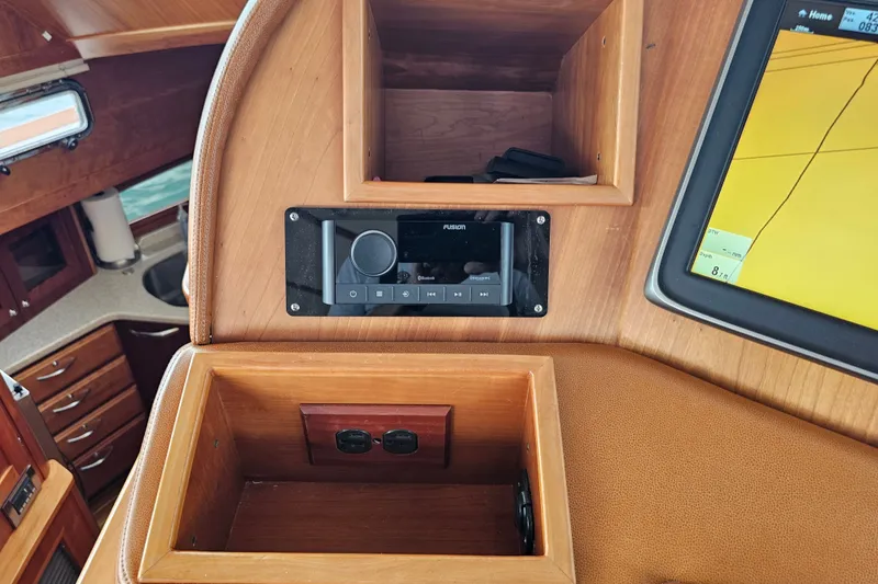 Slide: The Image of Interior of 2013 Sabre 48 Salon Express with navigation system and wooden cabinetry. - 22
