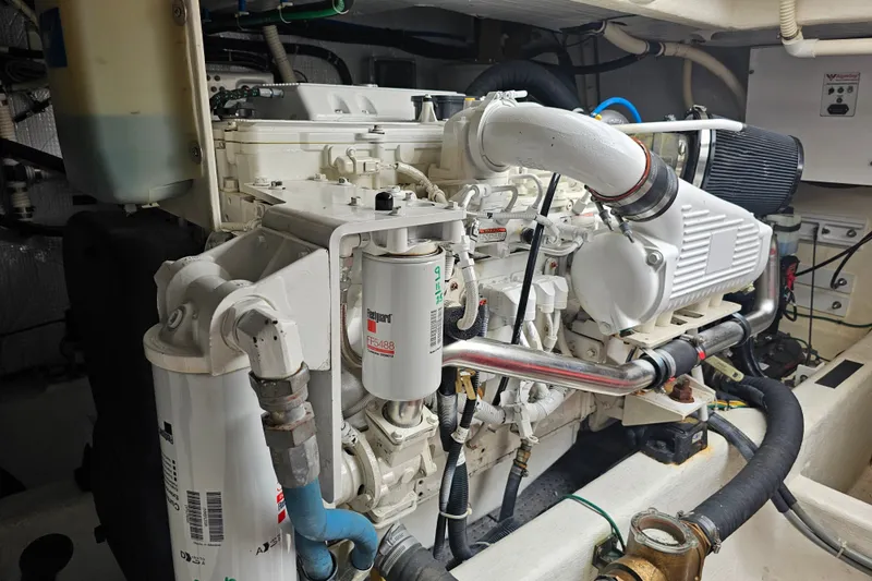 Slide: The Image of Engine room of a 2013 Sabre 48 Salon Express yacht, showcasing detailed machinery. - 58