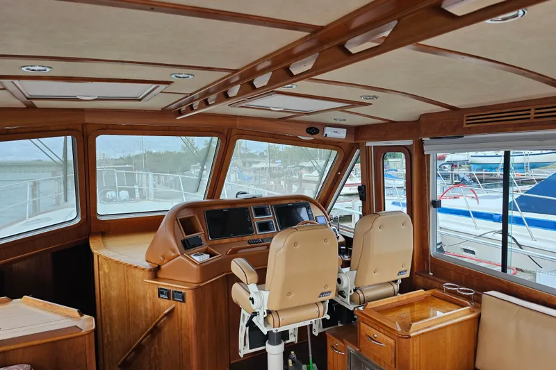 Slide: The Image of Interior of 2013 Sabre 48 Salon Express yacht with wooden finish and navigation controls. - 14