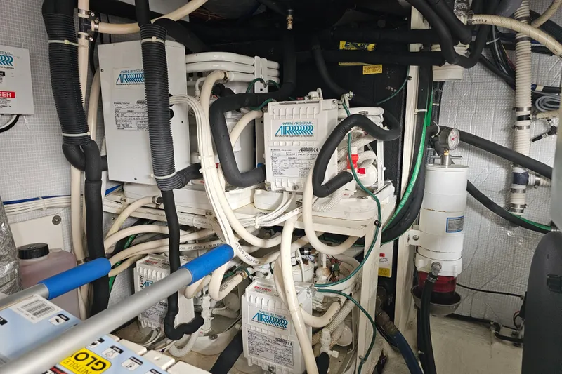 Slide: The Image of Engine room of a 2013 Sabre 48 Salon Express with complex wiring and equipment. - 65