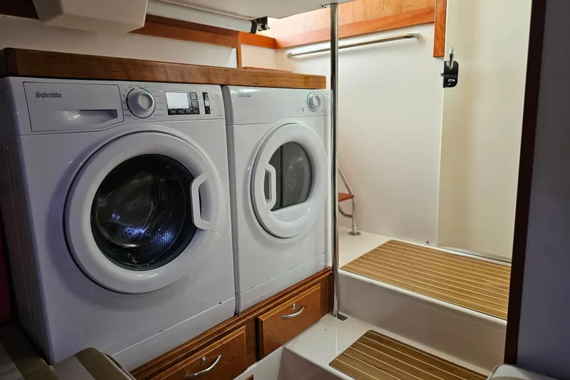 Slide: The Image of Laundry area with washer and dryer on 2013 Sabre 48 Salon Express yacht. - 55