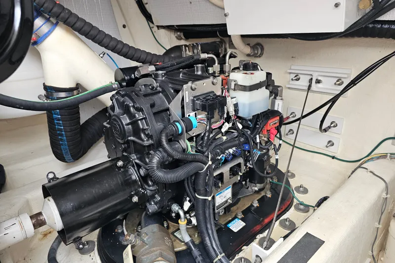 Slide: The Image of Engine room of a 2013 Sabre 48 Salon Express, showcasing detailed mechanical components. - 60