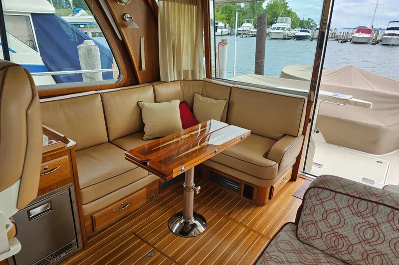 Slide: The Image of Luxurious interior of 2013 Sabre 48 Salon Express yacht with leather seating and wooden table. - 10
