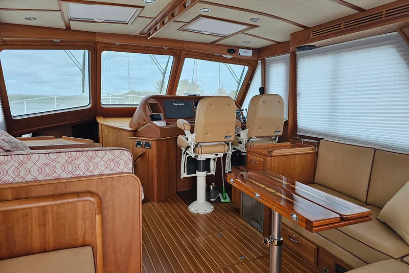 Slide: The Image of Interior of 2013 Sabre 48 Salon Express yacht with luxurious wood finish and seating. - 13