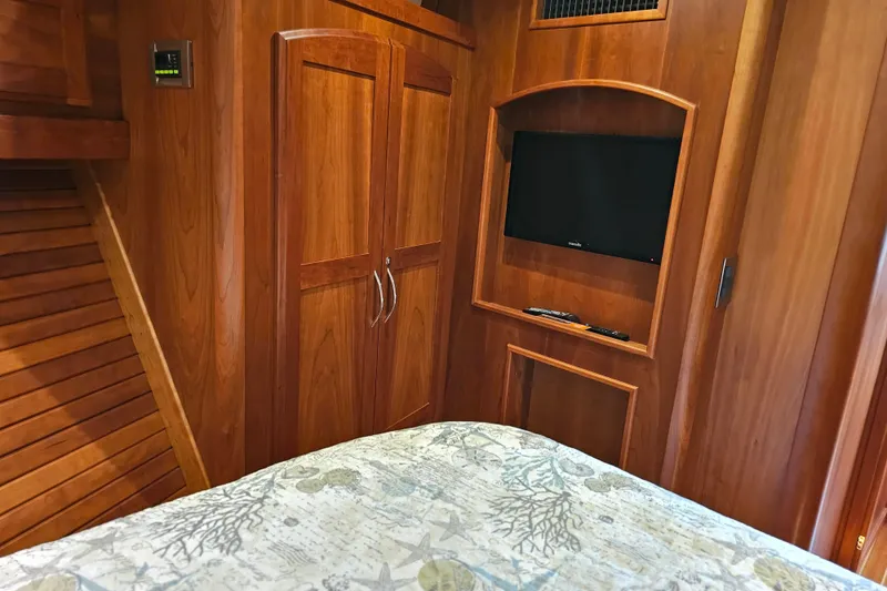 Slide: The Image of Interior of 2013 Sabre 48 Salon Express with wood paneling and mounted TV. - 46