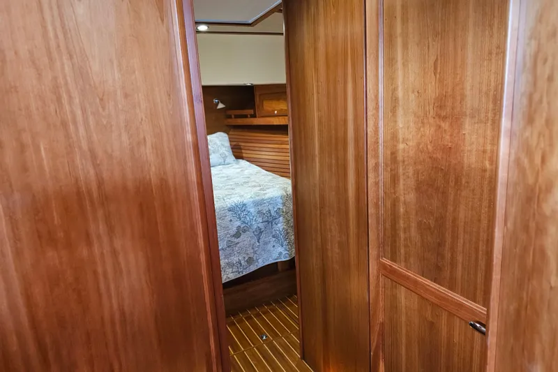 Slide: The Image of Interior view of 2013 Sabre 48 Salon Express cabin with wooden finish and bed. - 43