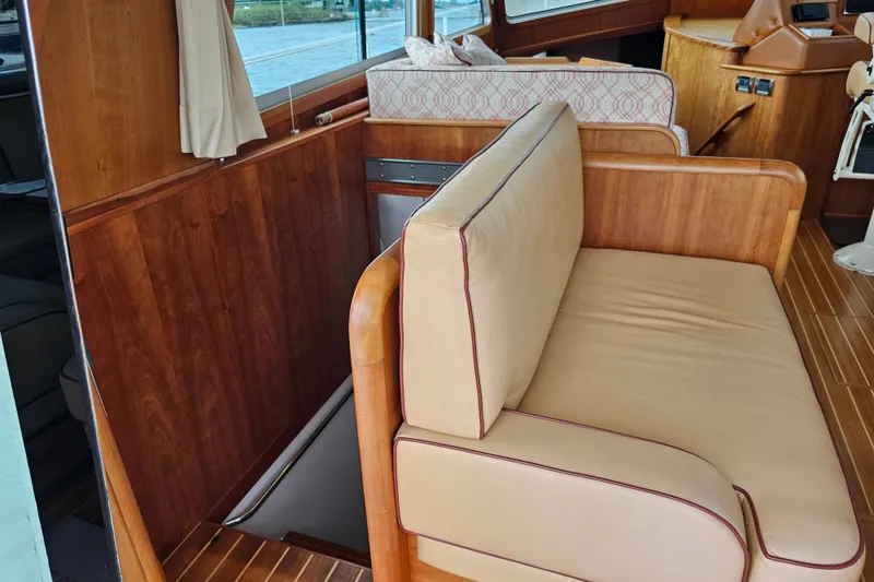 Slide: The Image of Interior of 2013 Sabre 48 Salon Express with wooden finish and beige seating. - 16