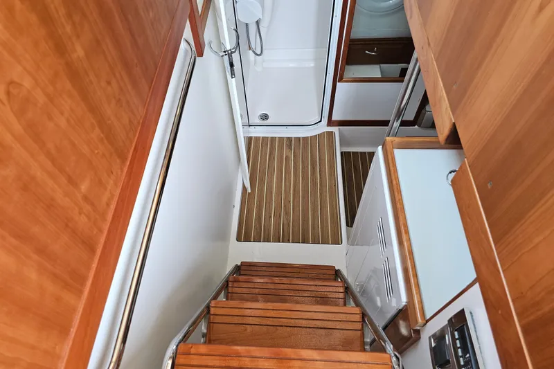 Slide: The Image of Staircase leading to lower cabin in 2013 Sabre 48 Salon Express yacht interior. - 51