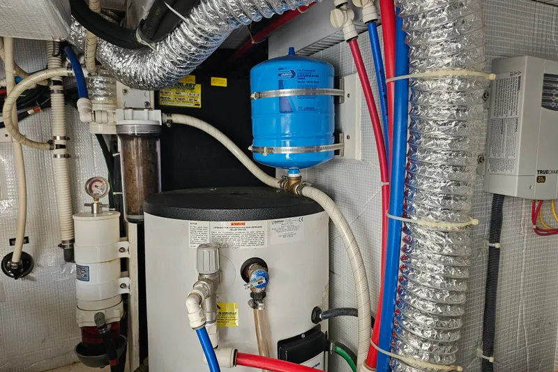 Slide: The Image of Engine room of 2013 Sabre 48 Salon Express with plumbing and ventilation systems. - 64