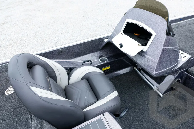 Slide: The Image of 2015 Legend V-20 boat interior with gray seating and open storage compartment. - 29