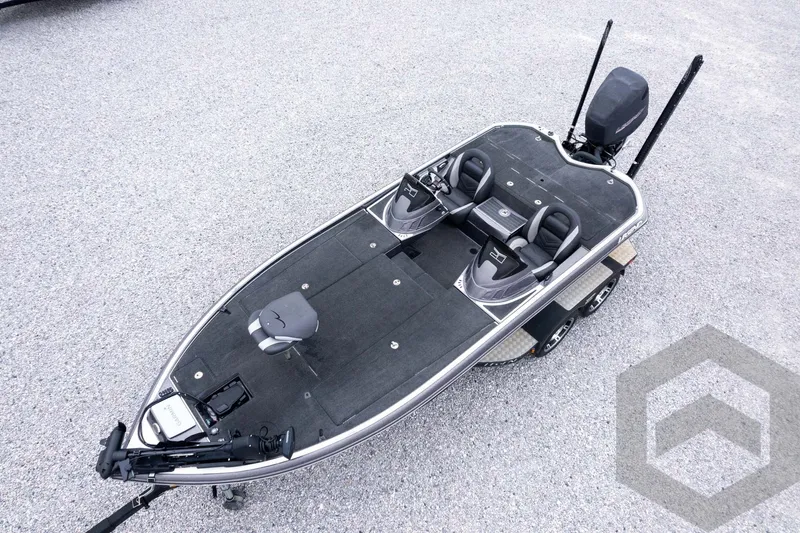 Slide: The Image of 2015 Legend V-20 fishing boat with dual seats and trolling motor on gravel. - 40