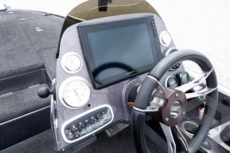 Slide: The Image of Dashboard of a 2015 Legend V-20 boat with Garmin display and gauges. - 26